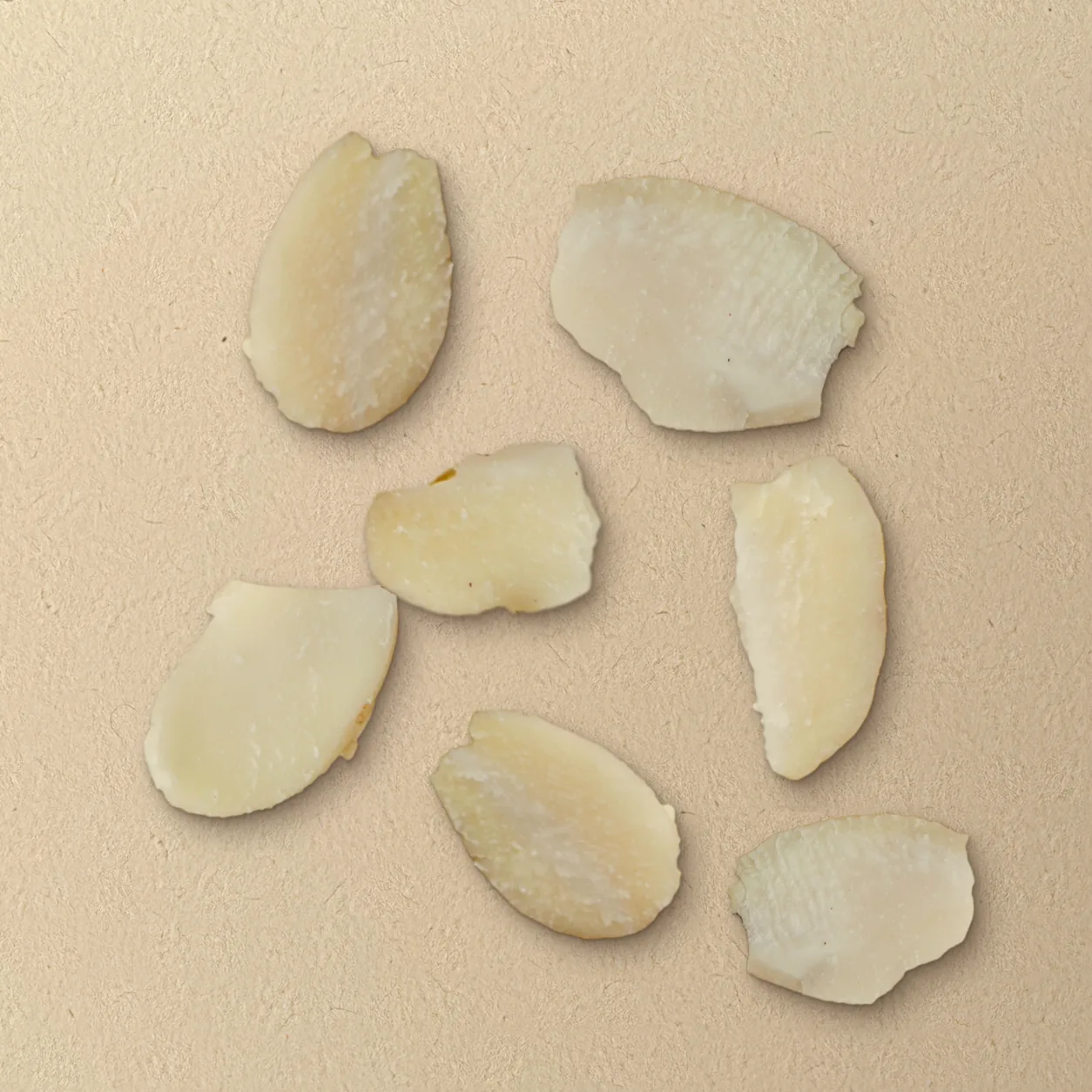 Blanched sliced almonds on unbleached paper